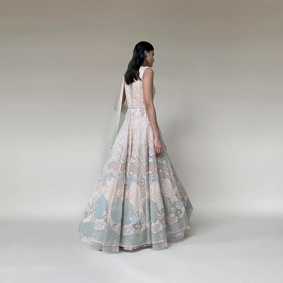 Silk organza floor length multi kali anarkali embellished with nice resham, pearl and katdana detailing. there is a fine play of various textures and motifs that gives the look a unique feel. The style has a cancan skirt and a net embellished dupatta. the look has elegance and style as the main vibe and looks stunning with diamonds and pearls. abhishek sharma, abhishekstudio
