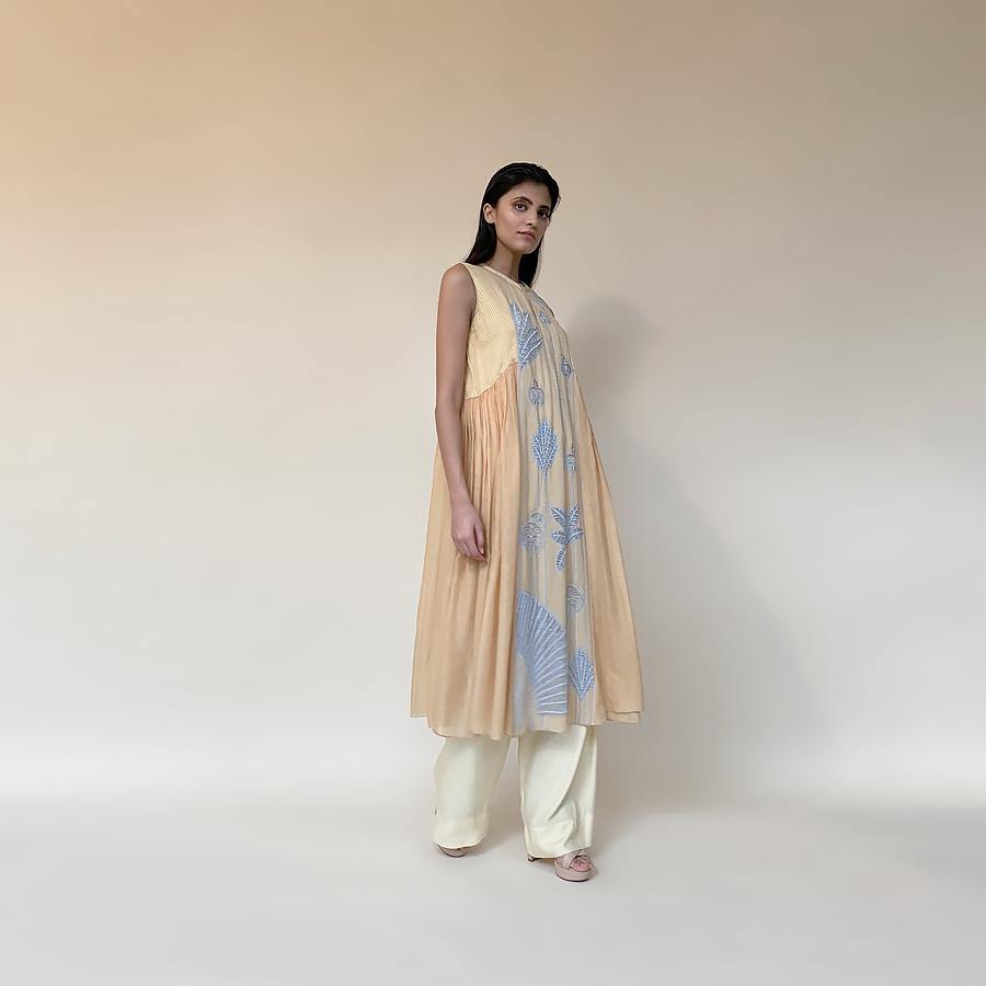 Fine voil panelled applique embroidered long tunic teamed up with wide pants and contrast lining. The style is an easy fit with gathers on side panels. It's a perfect style for an easy chilled out day or evening. 