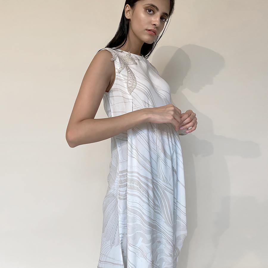 Moss Crepe printed cowled draped dress. The drape is one sleeve style with placement embroidery in fine Resham and pearl. the style can be worn as a dress with a lining or can be teamed up with denim or fitted pants as shot on the model. It's a perfect look for the day when you want be comfortable and elegant. abhishekstudio, Abhishek Sharma