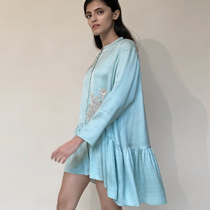 Satin gathered shirt with a narrow mandarin collar and 3D placement embroidery. The shirt enables a relaxed fit with buttoned front closure.  abhishek sharma, abhishekstudio