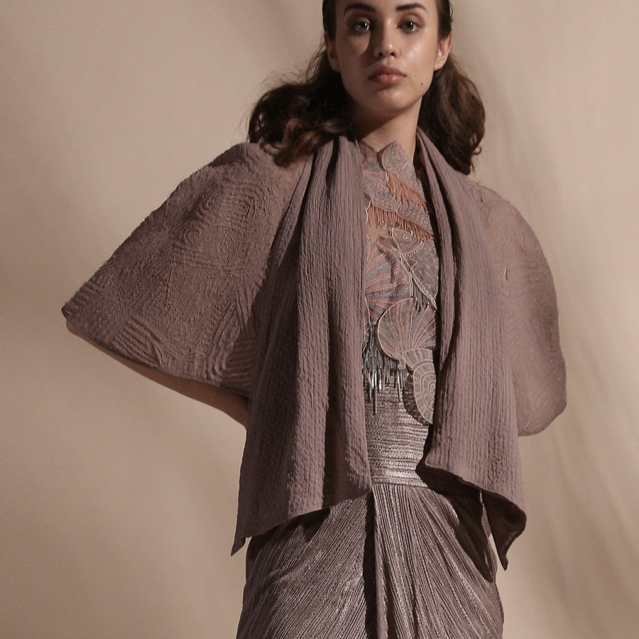 Yarn Textured High Waisted Draped Skirt, Embellished Top And Textured Cape.