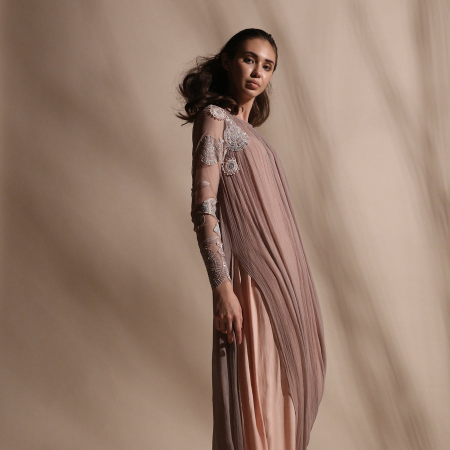 Gathered cowl draped kurta with embellished net sleeves.Dress is styled with a comfortable stretch net pants. Layered design combines fluid shapes with pearl and sequin placement embroidery. abhishek sharma, abhishekstudio