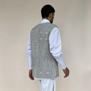 Open front quilt texture bundi with round neckline. Unlined bundi is finished with ivory cotton braid.  abhisheksharma , abhishekstudio