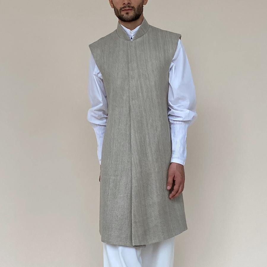 Shaped mandarin collar sherwani with front overlap closure. Heavy weight woven texture linen sherwani features square armhole and slightly layered panels for that extra ease while sitting and or on the go.  abhisheksharma , abhishekstudio