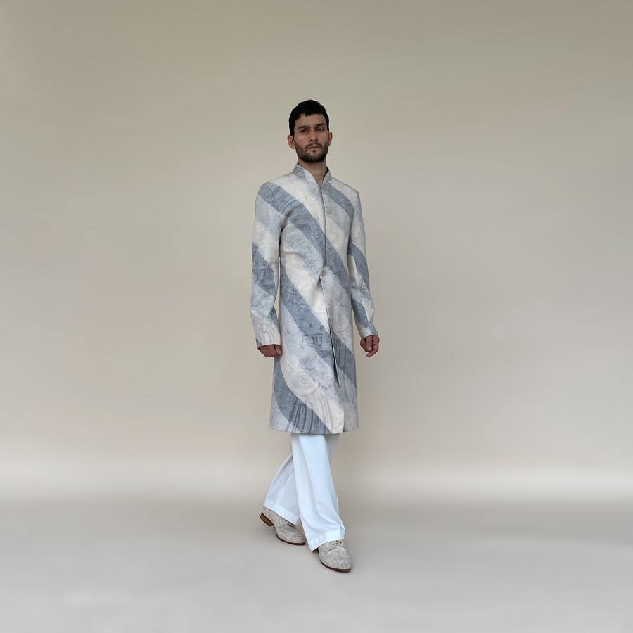 Short length single button closure sherwani with concealed placket. Cotton khadi sherwani is meticulously printed in abstract bias stripes.  abhisheksharma , abhishekstudio
