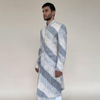 Short length single button closure sherwani with concealed placket. Cotton khadi sherwani is meticulously printed in abstract bias stripes.  abhisheksharma , abhishekstudio