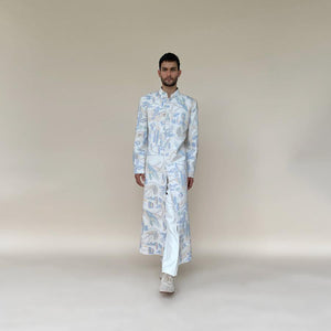 Classic mandarin collar sherwani with a buttoned closure. Heavyweight Matka silk sherwani features high slits and slightly flared panels for that extra ease while sitting or on the go. Sherwani is embellished in abstract impression pattern with multicolour silk thread.  Abhishek Sharma, abhishekstudio