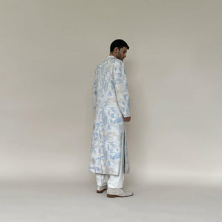 Classic mandarin collar sherwani with a buttoned closure. Heavyweight Matka silk sherwani features high slits and slightly flared panels for that extra ease while sitting or on the go. Sherwani is embellished in abstract impression pattern with multicolour silk thread.  Abhishek Sharma, abhishekstudio