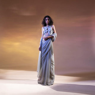 Chiffon saree with satin edging having draped satin detailed blouse. This saree is a perfect blend of Indian and western. The saree has a very young and modern vibe to match your personality. The look is totally for someone who believes in "less is more".  The saree is ideal for a high tea or a gathering where you want to look your best by playing understated yet stunning.  abhishekstudio, abhisheksharma