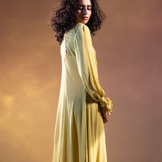 Textured crepe panelled draped long tunic with tie-up sleeve detailing. The tunic has fine Resham placement embroidery.   Styling: the tunic can be worn as a dress as shot on the model. The tunic can also be teamed up-fitted pants. The look is a perfect day and evening. You can stylise the look with big pearl springs or you can keep it simple and carry a statement clutch. Keep the heels very simple so that the complete look doesn’t get busy and stays chick. Abhishekstudio Abhishek Sharma
