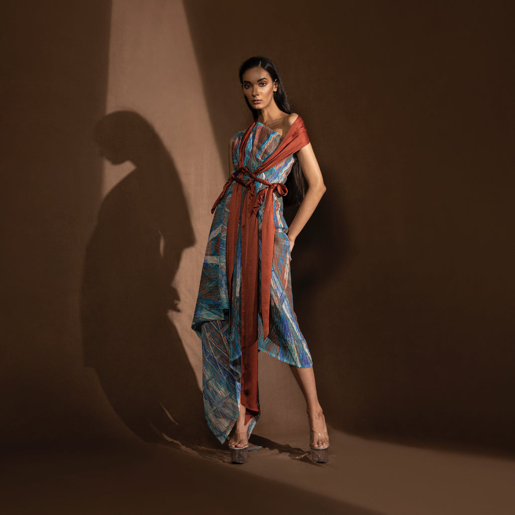 Asymmetrical one-off-shoulder draped dress accented with satin sashes draped to give an interesting look.  #drape #dresses #abhisheksharma