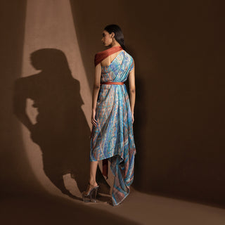 back view of Women's printed asymmetric midi dress with rust belt and shoulder drape – elevated summer tunic with back draped detail