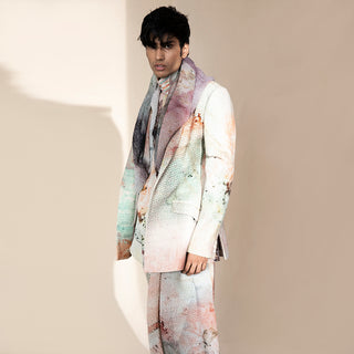 Close-up of men’s crystalline abstract print shawl collar jacket with layered scarf – luxury printed suit, high-fashion menswear look