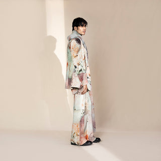 Men's side view in abstract crystalline print jacket with matching relaxed trousers – artistic menswear set, luxury fashion-forward silhouette