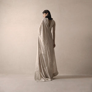 back view of Women's heritage-inspired chikankari saree with fine hand embroidery and deep back blouse – timeless draped couture for formal events
