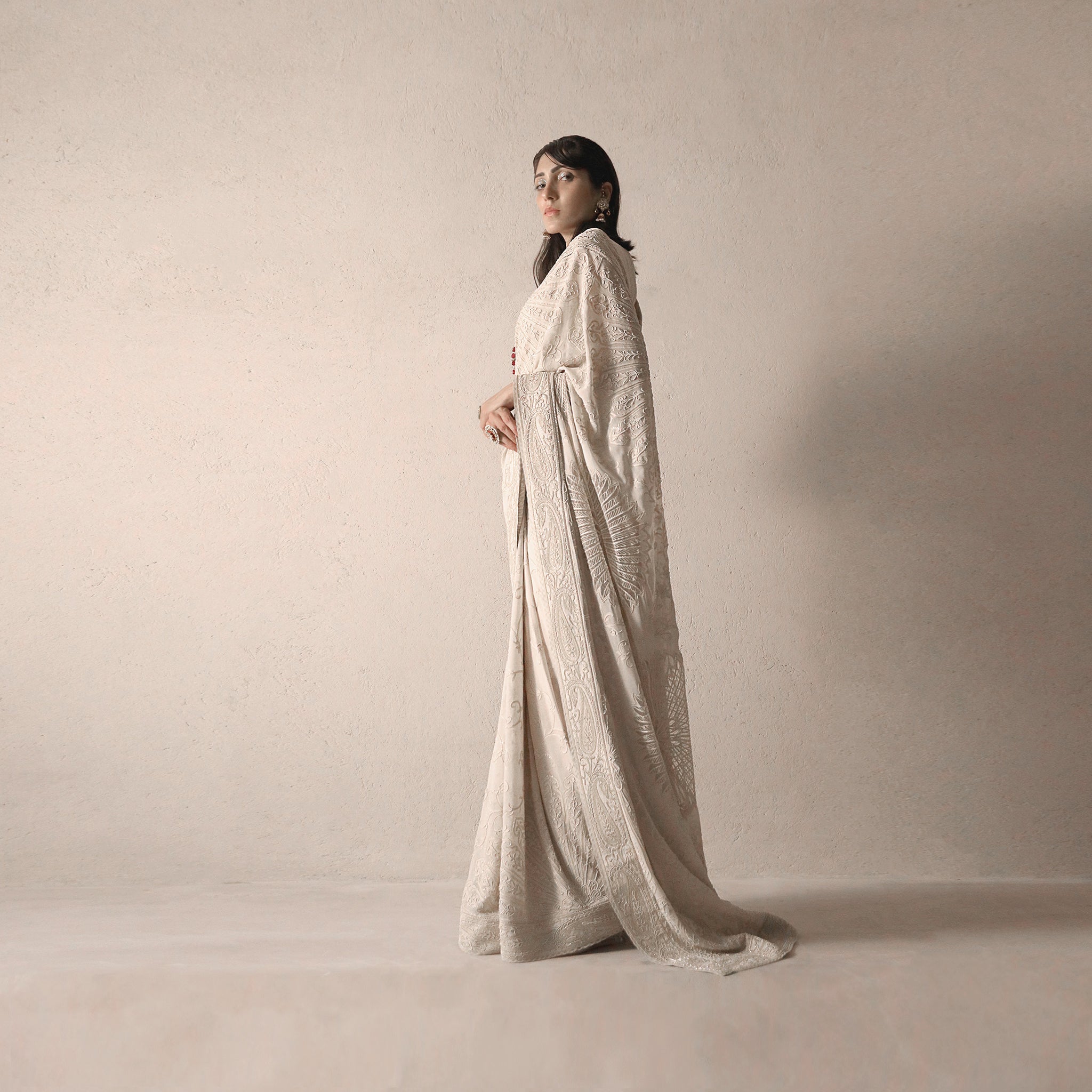side shot of Women's pre-pleated fine chikankari saree with delicate embroidery and heritage drape – timeless couture look for formal occasions