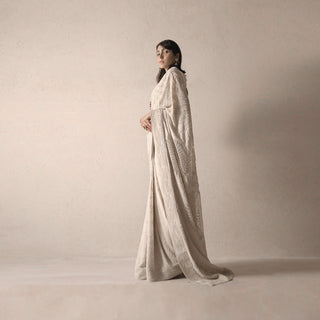 side shot of Women's pre-pleated fine chikankari saree with delicate embroidery and heritage drape – timeless couture look for formal occasions