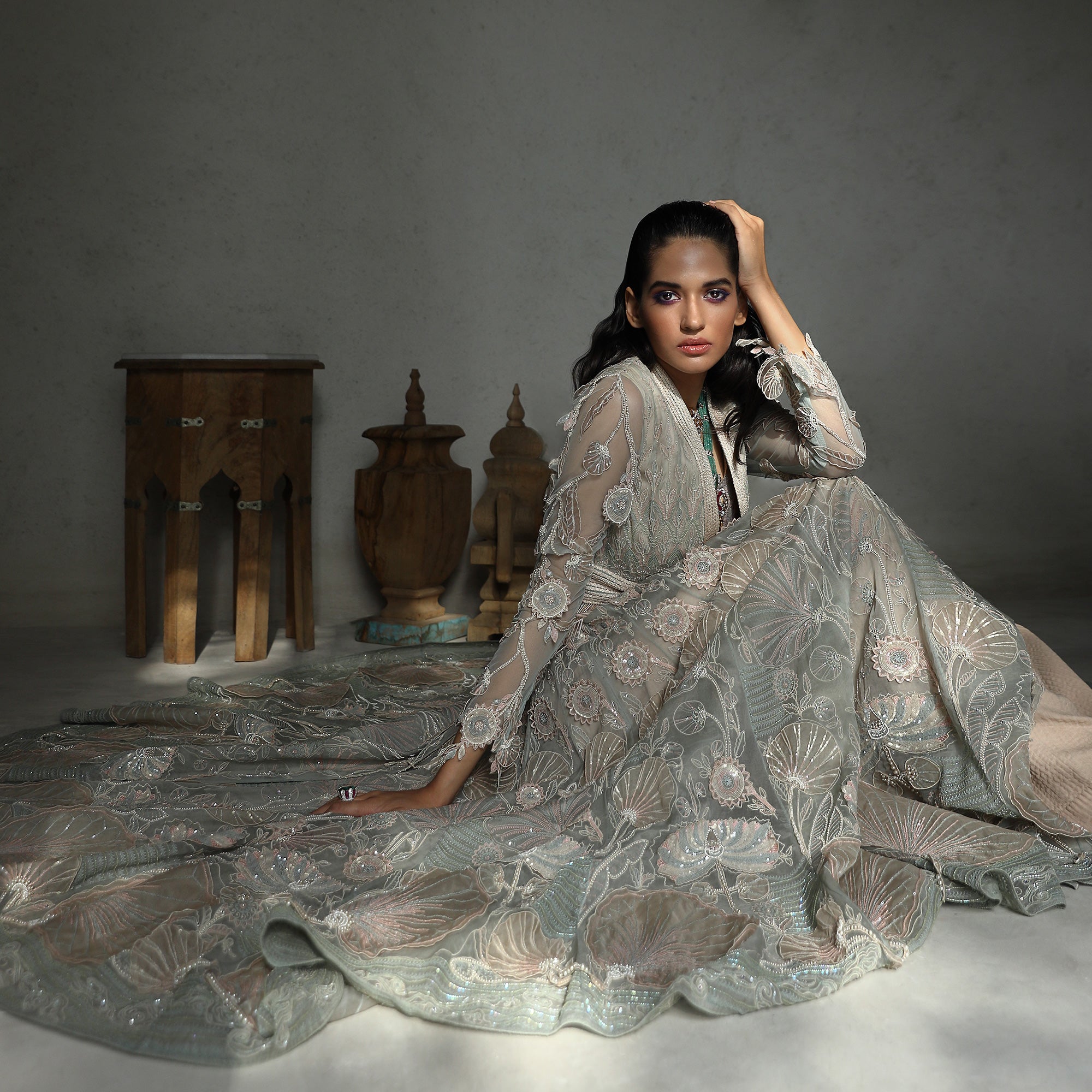 seated view of Women's delicately embroidered floor-length flared jacket with sheer sleeves – sophisticated traditional couture for reception wear