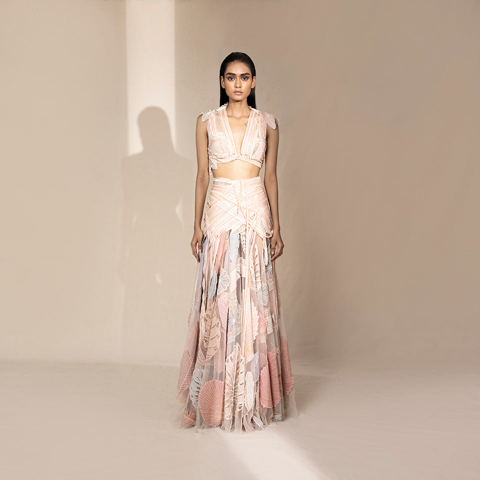 full-body front shot of Women's pastel embroidered crop top with high-waisted skirt – designer festive wear with leaf motifs, perfect for sangeet events