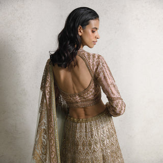 upper-back view of Women's embroidered bridal blouse with open back and full sleeves – paired with ornate lehenga for a royal wedding look
