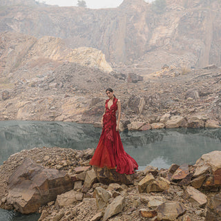 wide shot of Women's deep red embroidered gown with satin panel trail and plunging neckline – couture reception eveningwear