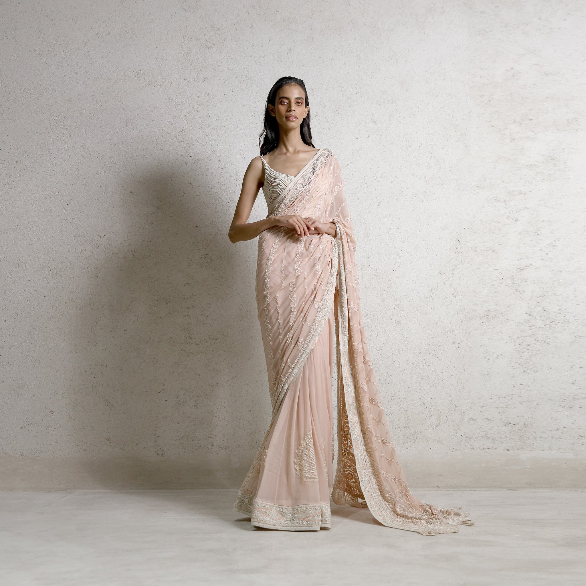 Pre-draped fine chikankari saree with pearl and crystal embellishments – luxe ethnic style, bold luxury look