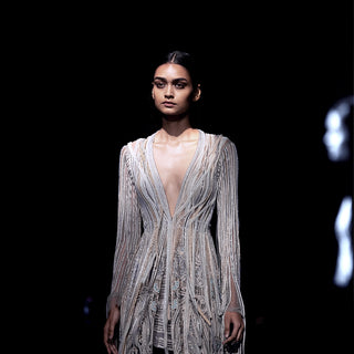 Women's silver pearl-embellished jacket with tassel fringe detailing – opulent designer layering piece for couture events