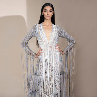 upperbody front view of Women's deep V-neck silver jacket with pearl tassel sleeves and ornate embroidery – luxe couture silhouette for fashion-forward events