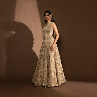 Gold lehenga with drip embroidery one off shoulder blouse – bridal or occasion lehenga with artistic detailing, designer party set, top and skirt, sangeet look.