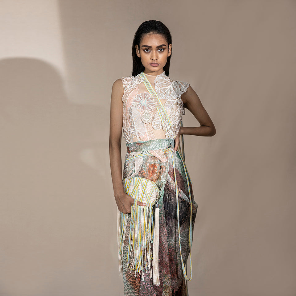 front shot of Women's pre-pleated graphic saree with abstract shimmer texture styled with floral embellished blouse – artistic modern draped saree look