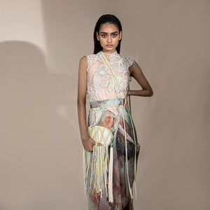 front shot of Women's pre-pleated graphic saree with abstract shimmer texture styled with floral embellished blouse – artistic modern draped saree look