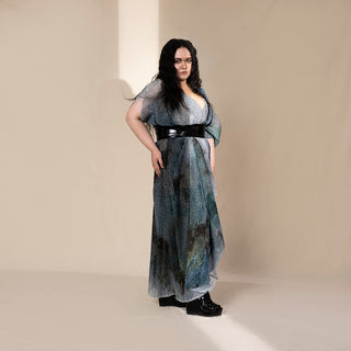 profile shot of Women's layered graphic shimmer dress with flared hem and black obi belt – crystal-textured party gown for youngster evening looks