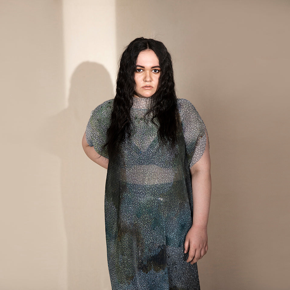 Women's sheer crystallised midi dress with structured neckline and short sleeves – edgy translucent evening look