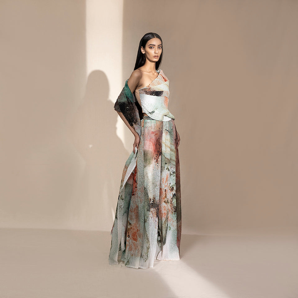 profile shot of Women's one-shoulder crystallised wrap top with fluid abstract wide-leg pants – bold contemporary co-ord for evening elegance