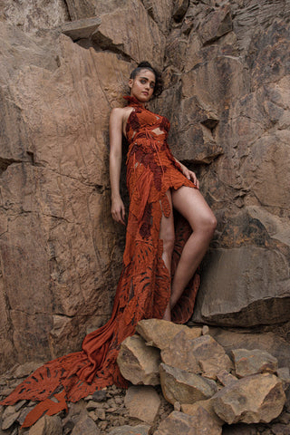 full body view of Women's rust orange halter-neck gown with leafy applique and thigh-high slit – modern cocktail look for youngsters