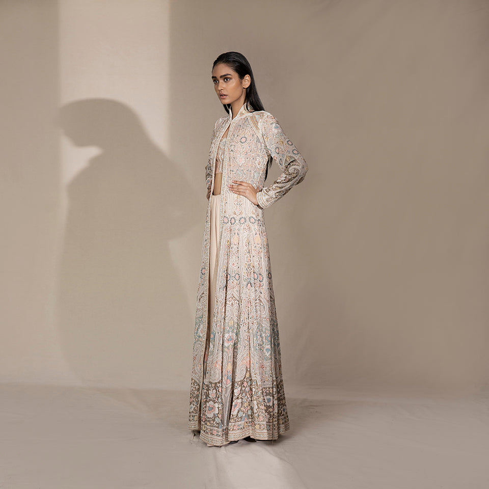 Women's pastel floor-length flared jacket with standing collar and floral shadow embroidery – bridal couture outerwear with handcrafted finesse