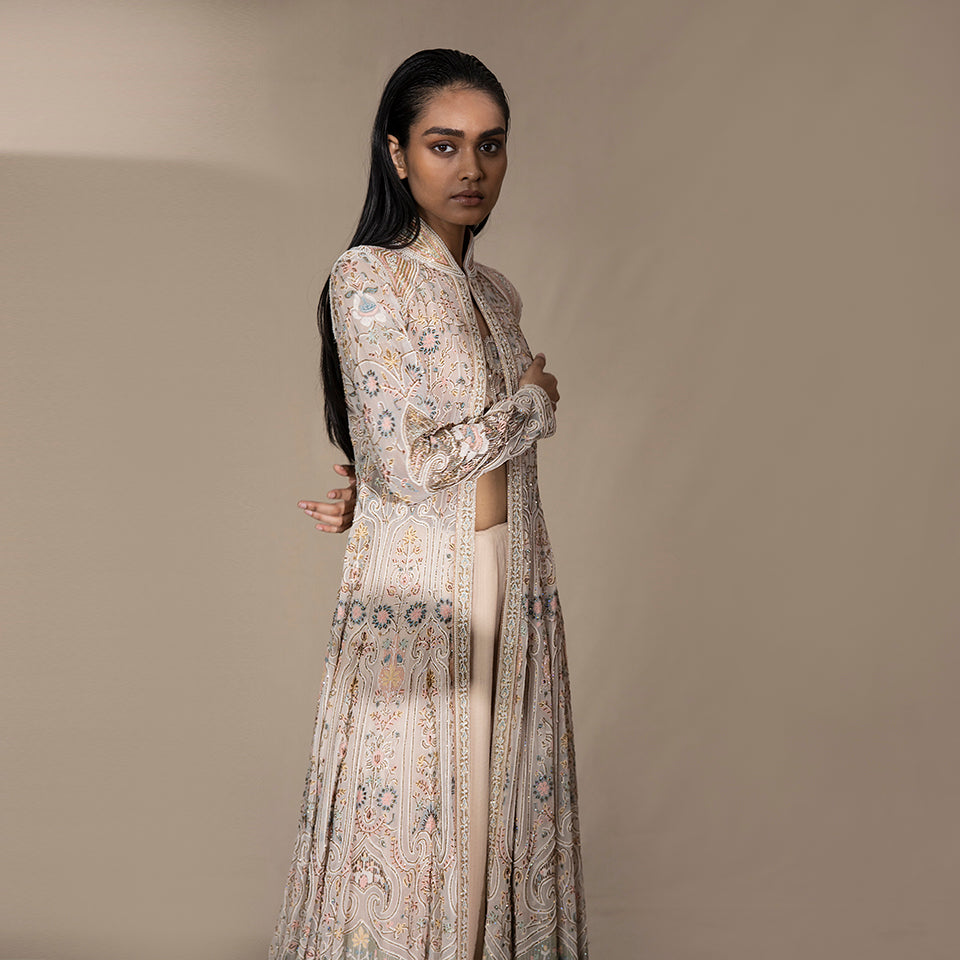 Women's ivory pastel flared jacket with fine floral shadow embroidery and standing collar – handcrafted couture for bridal events