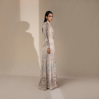 profile shot of Women's ivory pastel flared jacket with long sleeves and fine floral shadow embroidery – handcrafted bridal layering for couture events