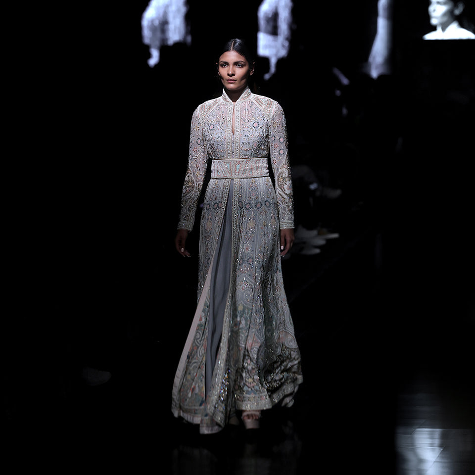 Women's pastel embroidered flared jacket with cinched waist and high collar – runway bridal couture with floral shadow detailing