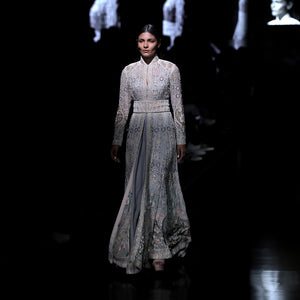 Women's pastel embroidered flared jacket with cinched waist and high collar – runway bridal couture with floral shadow detailing