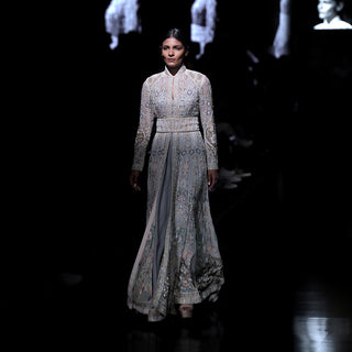 Women's pastel embroidered flared jacket with cinched waist and high collar – runway bridal couture with floral shadow detailing