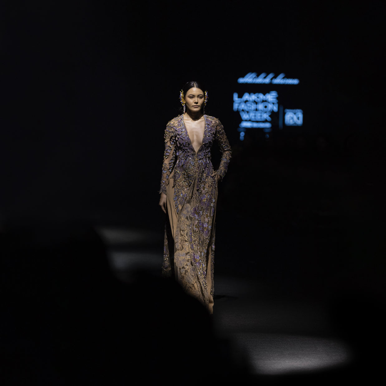 runway shot of Women's deep plunge embroidered runway jacket with lavender gold detailing – couture fashion week look, full sleeve designerwear