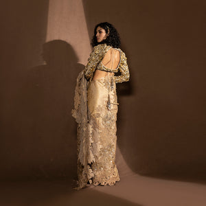 back view of Women's metallic saree with sequin floral detailing and embellished back-tie blouse – pre-pleated draped Chanderi saree with layered leaf motifs, festive couture set