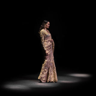 runway shot of Women's metallic mauve embroidered saree with layered floral applique and structured blouse – pre-pleated couture drape with embellished shrug, evening runway look