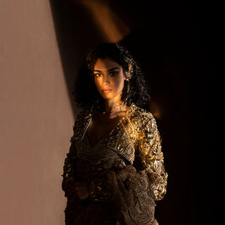 upperbody view of Women's embellished shrug and structured blouse paired with textured Chanderi saree – intricate hand embroidery with metallic finish, festive couture ensemble