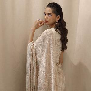 profile shot of Women's pre-draped chikankari saree with circular jaali motifs and ornate border – handcrafted elegance for weddings and traditional functions 
