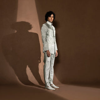 side shot of Men's sculpted Bandhgala set with silk yarn drape and tonal embroidery – experimental fusion suit with architectural texture, cocktail or runway wear