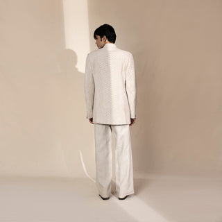Men's ivory Bandhgala suit with tonal chevron texture and structured longline back – minimal Indian festive ensemble