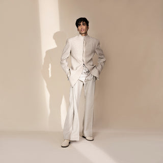 full front view of Men's ivory chevron Bandhgala with layered leaf-textured shirt and wide-leg pants – artistic Indian fusion suit