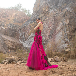 full side view of Women's fuchsia and black couture gown with sculpted applique and tulle flare – daring red carpet designer piece